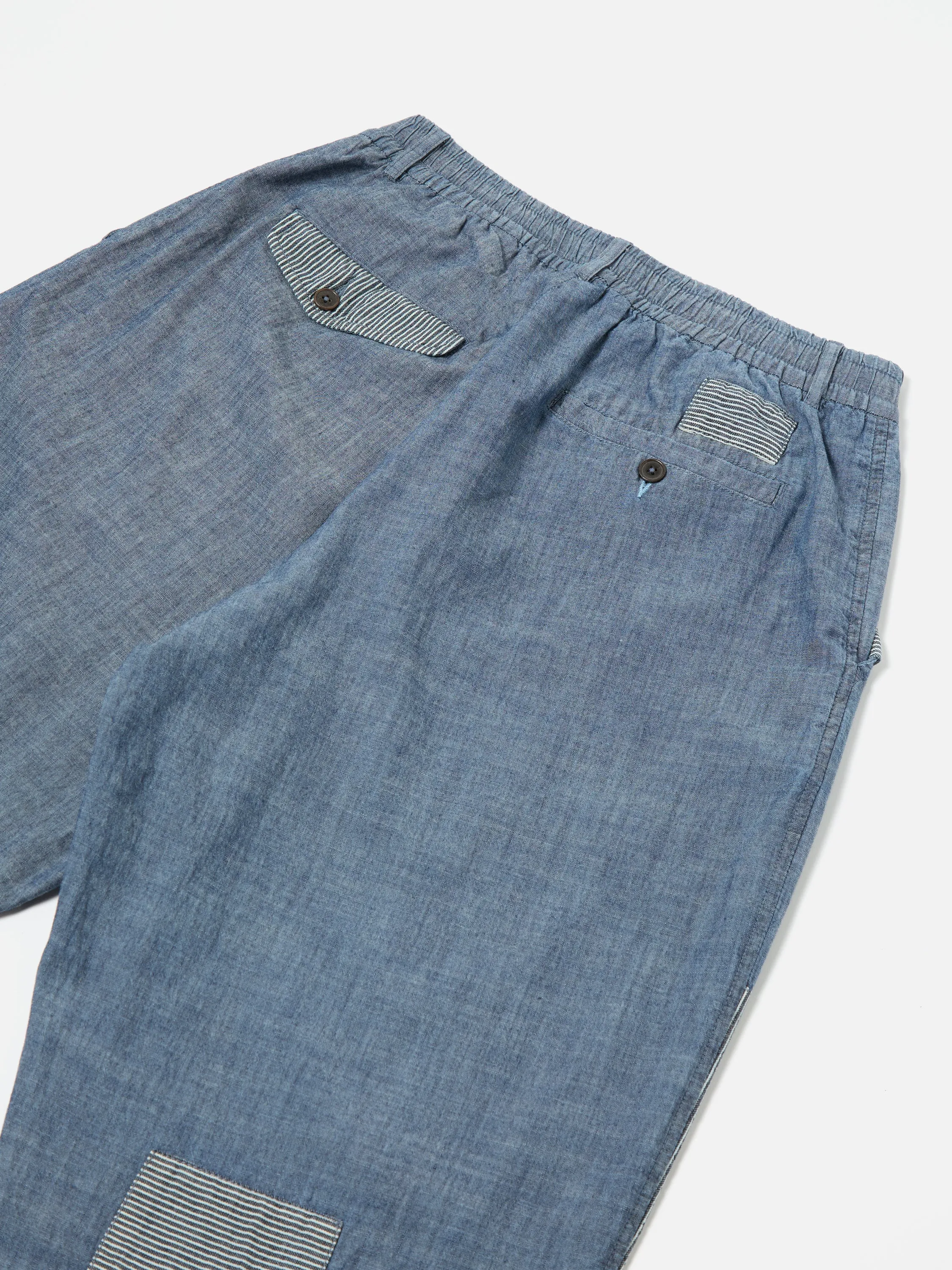 Universal Works Patched Pleated Track Pant in Indigo Chambray/Hickory Stripe Denim